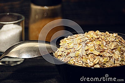 Health food concept - bowl of cereal with spice and spoon Stock Photo