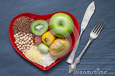 Health food on a red heart plate diets abstract still life Stock Photo