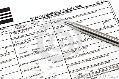 Health Insurance Claim Form with Silver Pen Stock Photo