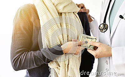 Health insurance concept, Patient paying doctor for medical service with money dollar banknote. Stock Photo