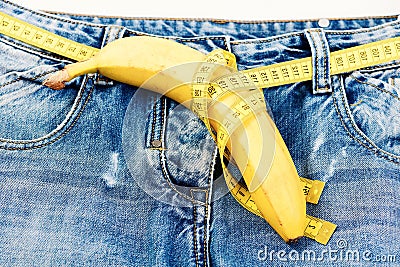 Health and male sexuality concept: jeans crotch and banana Stock Photo