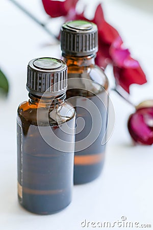 Health products and cosmetics. Herbal and mineral skin care. A jar of oil, dark cosmetic bottles. Without a label Stock Photo