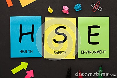 Health Safety Environment - HSE text on color notes Stock Photo