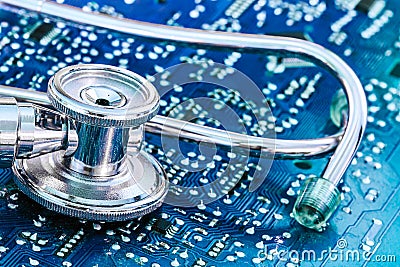 Health and Technology Stethoscope on Circuit Board Stock Photo