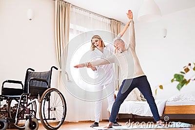 Health visitor and senior man during home visit. Stock Photo