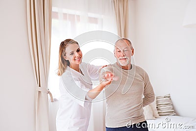 Health visitor and senior man during home visit. Stock Photo