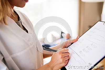 Health visitor and senior man during home visit. Stock Photo