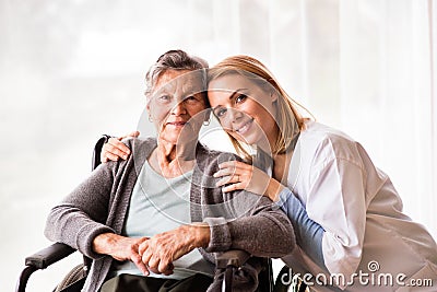 Health visitor and a senior woman during home visit. Stock Photo