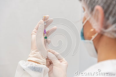 A health worker prepares a dose of Coronavac vaccine Editorial Stock Photo