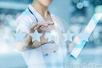 Health worker puts the rating stars . Stock Photo