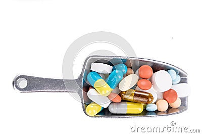 Healthcare concept on overhead view of ladle with scoop of various medicine tablet, caplets, pills, capsule Stock Photo