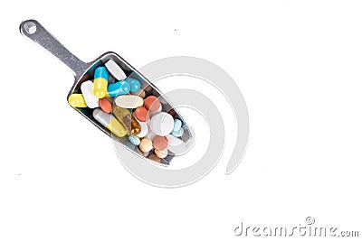 Healthcare concept on overhead view of ladle with scoop of various medicine tablet, caplets, pills, capsule Stock Photo