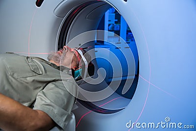 Senior male patient undergoing a MRI examination in a modern hospital Stock Photo