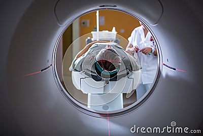 Senior male patient undergoing a MRI examination in a modern hospital Stock Photo