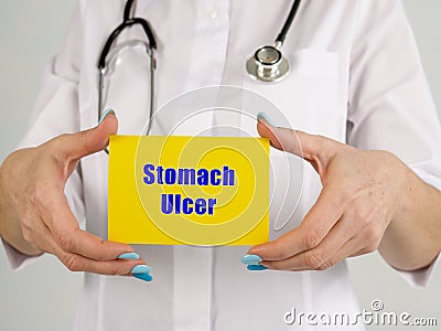 Healthcare concept about Stomach Ulcer Peptic Ulcer with sign on the piece of paper Stock Photo
