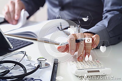 Healthcare costs and fees concept.Hand of smart doctor used a ca Stock Photo