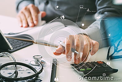 Healthcare costs and fees concept.Hand of smart doctor used a ca Stock Photo