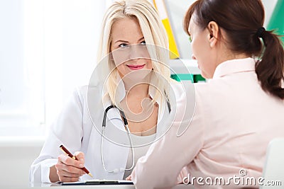 Healthcare and medical concept - doctor with patient in hospital Stock Photo