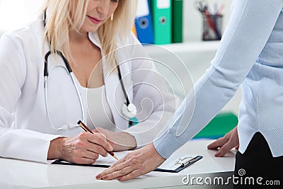 Healthcare and medical concept - doctor with patient in hospital Stock Photo