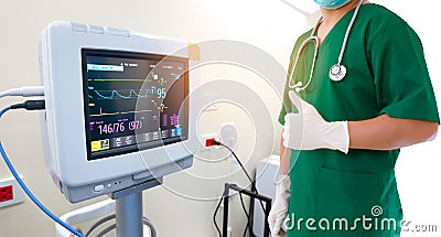 Healthcare and medical concept. Medicine doctor with stethoscope and gloves in hand and EKG Monitor . with pulse electrocardiogram Stock Photo