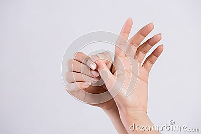 Healthcare and medical concept. Woman massaging her painful thumb finger Stock Photo