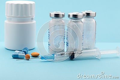 Healthcare and medicine concept.Syringe, pills Stock Photo