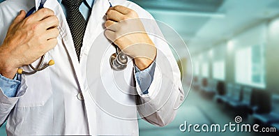 Healthcare and Medicine concept. Unrecognizable Male Doctor Holds Hands On Stethoscope Stock Photo