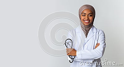 Portraif Of Black Islamic Female Doctor In Hijab Posing With Stethoscope Stock Photo