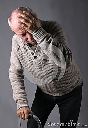 Healthcare, pain, stress and age concept. Sick old man. Senior man suffering from headache Stock Photo