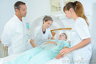 Healthcare team with patient Stock Photo