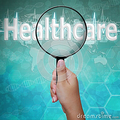 Healthcare, word in Magnifying glass Stock Photo