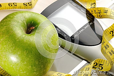 Healthy apple, measuring tape and scale Stock Photo