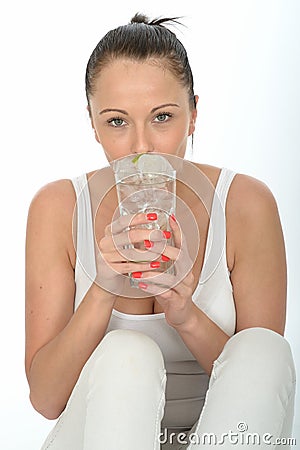 Healthy Attractive Young Woman Holding a Glass of Iced Water Stock Photo