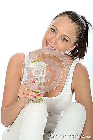 Healthy Attractive Young Woman Holding a Glass of Iced Water wit Stock Photo