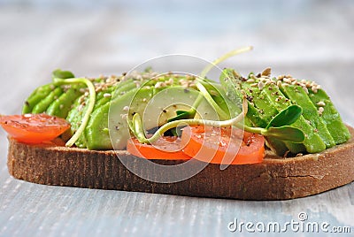 Healthy avocado sandwich , dark bread. Stock Photo