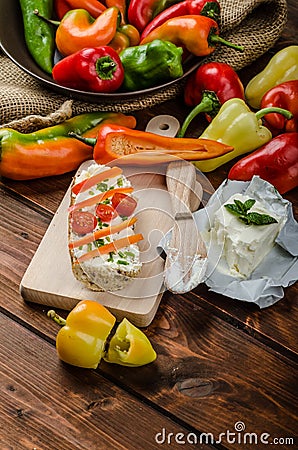 Healthy baguette, spread curd cheese with vegetable and herbs Stock Photo