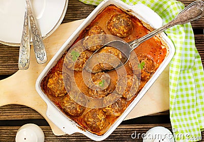 Healthy baked meatballs with rice in tomato sauce Stock Photo