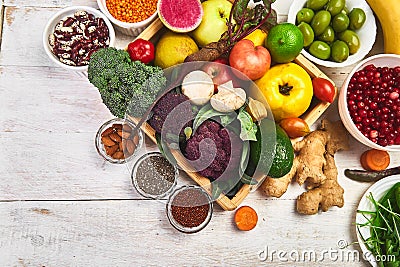 Healthy balanced vegan dieting concept. Vegetables fruit seeds beans ingredients for cooking. Organic vegetables, detox diet, clo Stock Photo