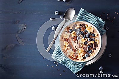 Healthy banana smoothie bowl with blueberry chocolate walnuts Stock Photo