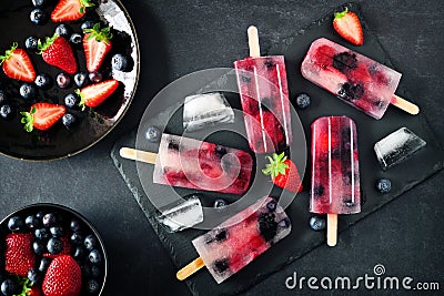 Healthy berry fruit popsicles, top view with stone server Stock Photo