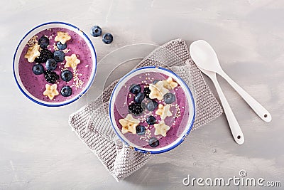 Healthy berry smoothie bowl with banana and sesame seed Stock Photo