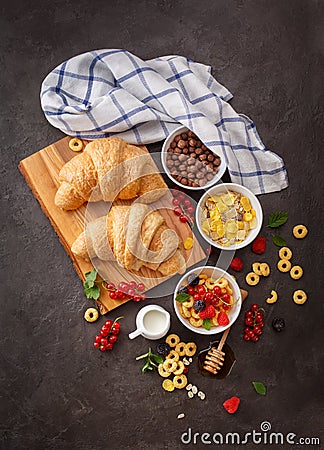 Healthy breakfast with berries and croissants. Stock Photo