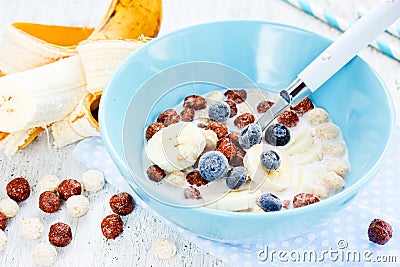 Healthy breakfast - cereal chocolate balls with milk, berries an Stock Photo