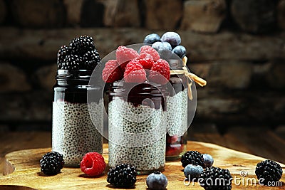 Healthy breakfast. chia pudding with kiwi and granola in glass o Stock Photo