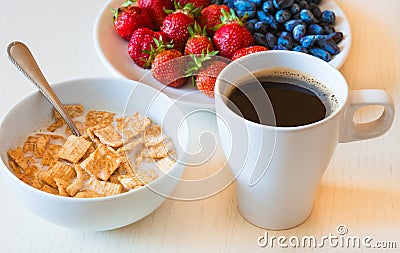 Healthy breakfast. Corn flakes with ripe red strawberry, blue ho Stock Photo