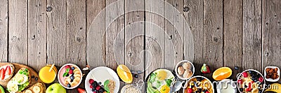 Healthy breakfast food banner with table scene bottom border of fruit, yogurt, smoothie bowl, nutritious toasts, cereal and egg sk Stock Photo