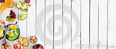 Healthy breakfast food banner with table scene side border of fruit, yogurt, smoothie, nutritious toasts and egg skillet over a wh Stock Photo