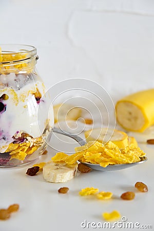 Breakfast in a jar: cereal, banana, berries, granola. The concept of healthy eating, high-carbon Breakfast. Stock Photo