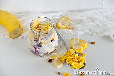 Breakfast in a jar: cereal, banana, berries, granola. The concept of healthy eating, high-carbon Breakfast. Stock Photo