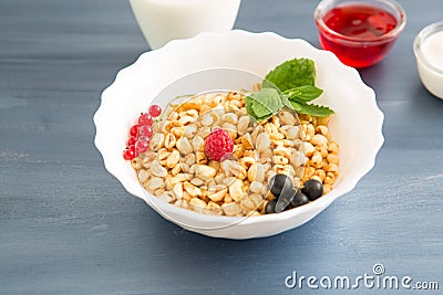 healthy breakfast with muesli and berry Healthy tasty breakfast of muesli with strawberries, raspberries, black currants Stock Photo